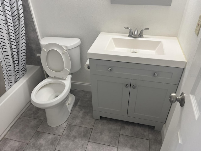 full bathroom with vanity, toilet, shower / bath combo with shower curtain, and tile patterned floors