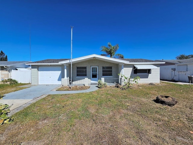 ranch-style home with a front lawn and a garage