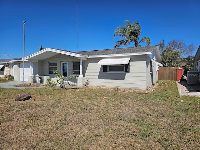 ranch-style house with a front yard and a garage