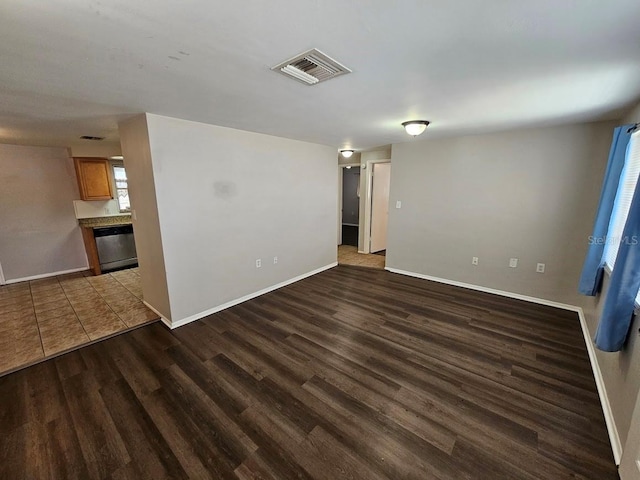 empty room featuring dark hardwood / wood-style flooring