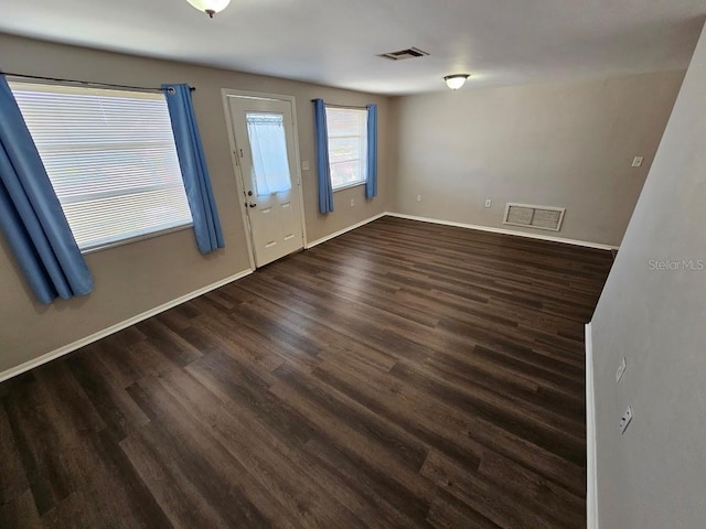 foyer entrance with dark wood-type flooring