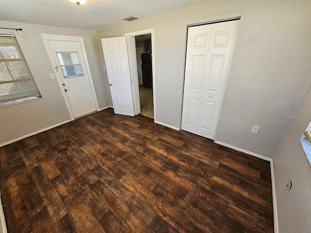 entrance foyer with dark hardwood / wood-style floors