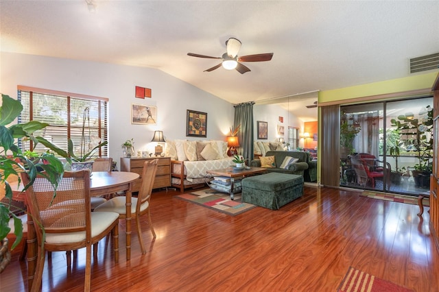 living room with lofted ceiling, ceiling fan, and hardwood / wood-style flooring