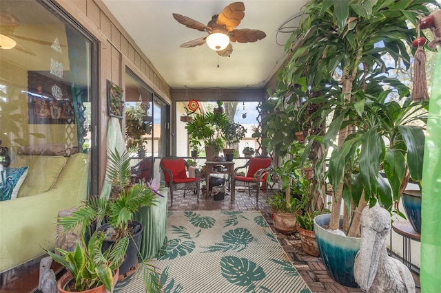 sunroom / solarium with ceiling fan