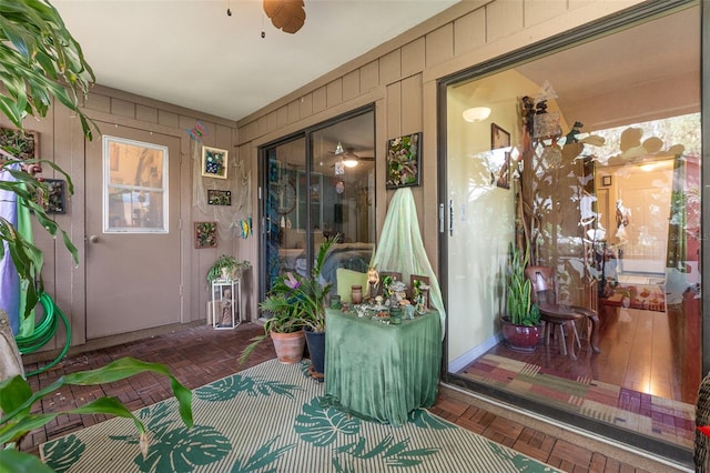 entrance to property with ceiling fan