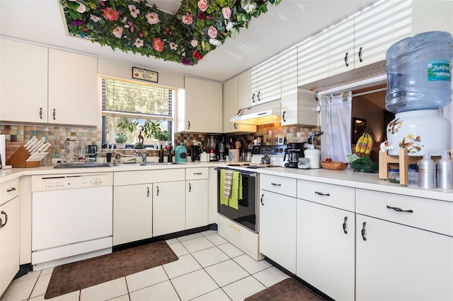 kitchen featuring white cabinets, white appliances, light tile patterned flooring, and tasteful backsplash