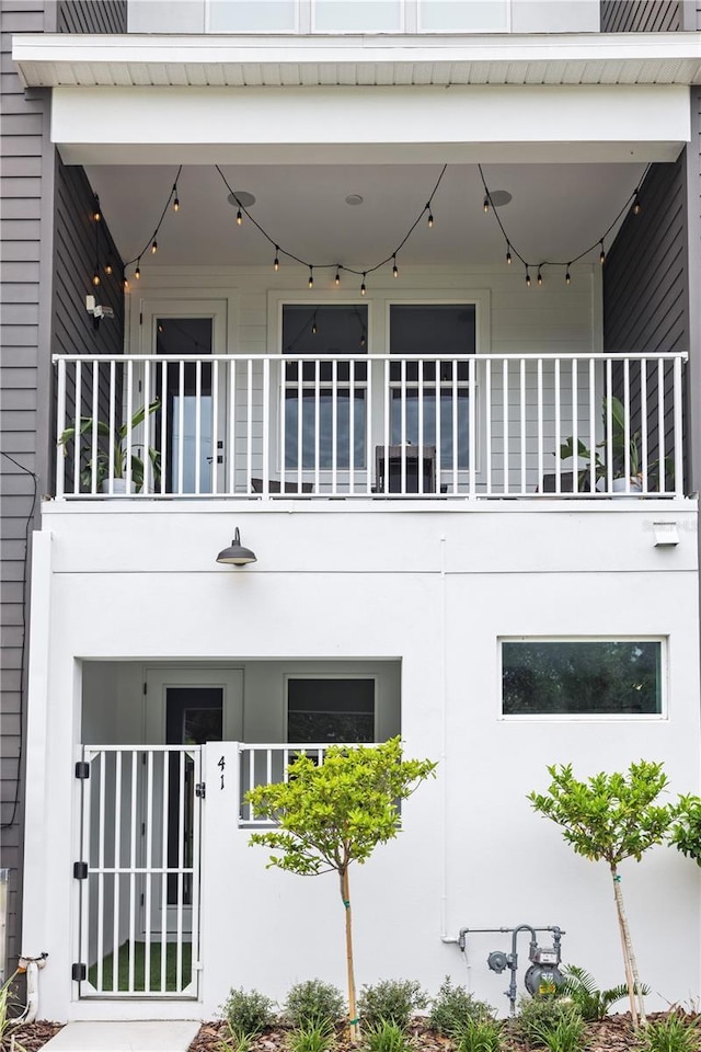 view of side of home with a balcony