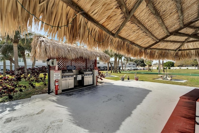 exterior space featuring area for grilling, a gazebo, and a yard