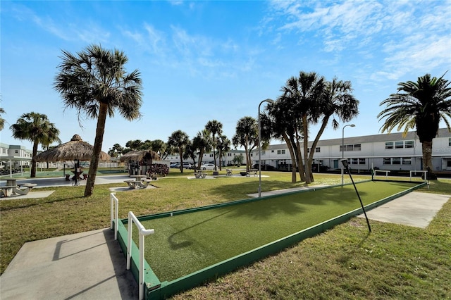 view of property's community with a yard