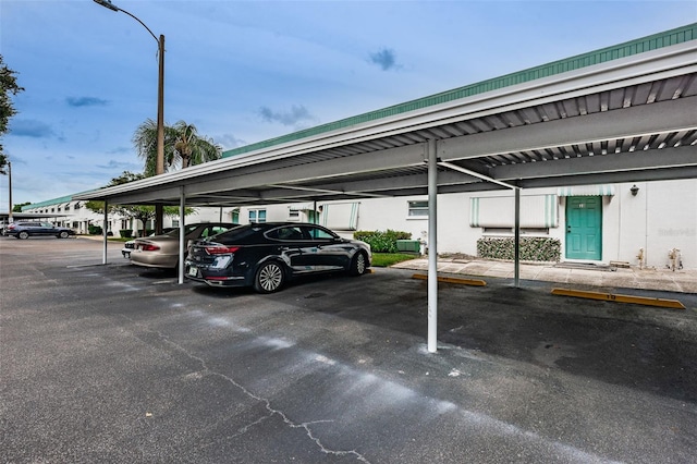 view of parking / parking lot with a carport