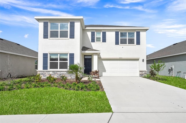 view of front of house featuring a garage and a front yard