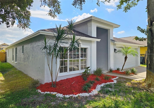 view of side of home with a garage