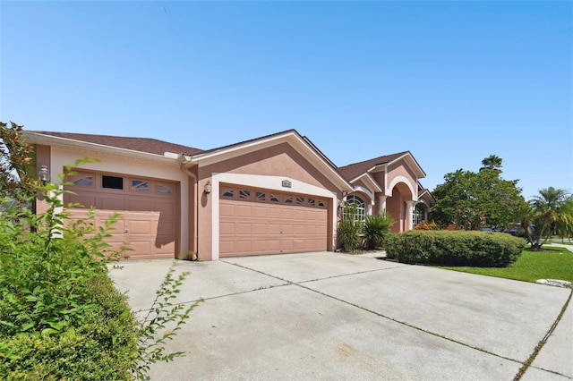 ranch-style house featuring a garage