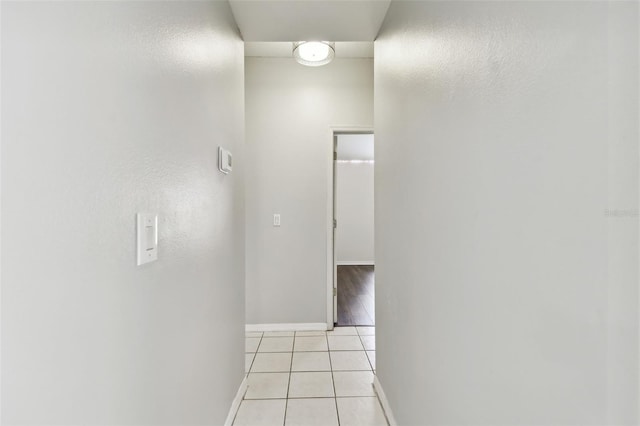 hall with light tile patterned flooring