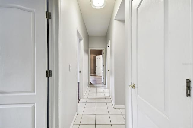 hallway with light tile patterned floors