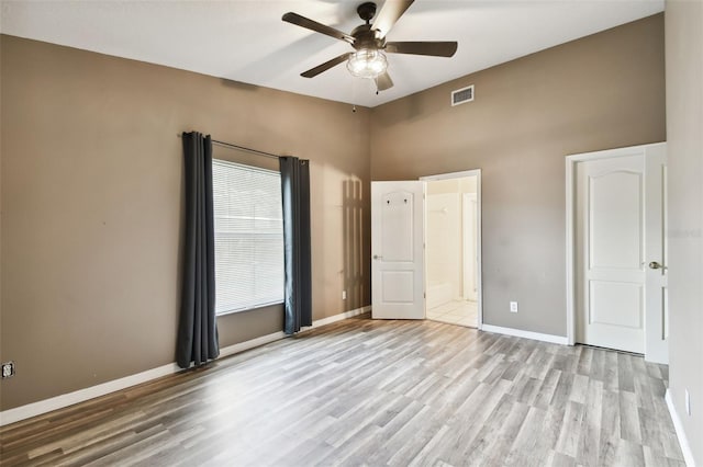 unfurnished bedroom featuring light wood-type flooring and ceiling fan