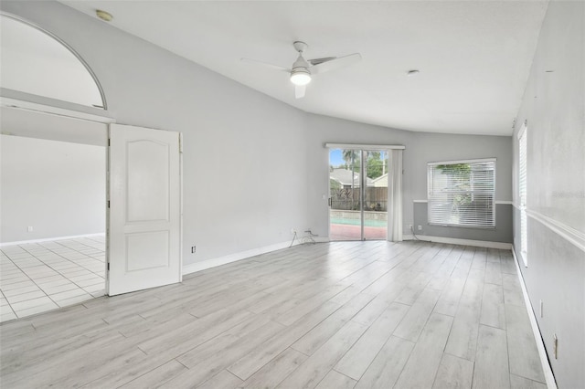 unfurnished room with light hardwood / wood-style flooring, lofted ceiling, and ceiling fan