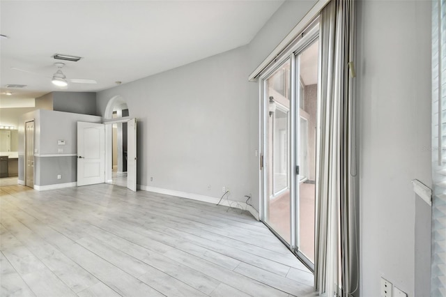 unfurnished room with ceiling fan and light hardwood / wood-style floors