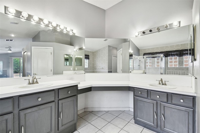 bathroom with vanity, tile patterned floors, and an enclosed shower