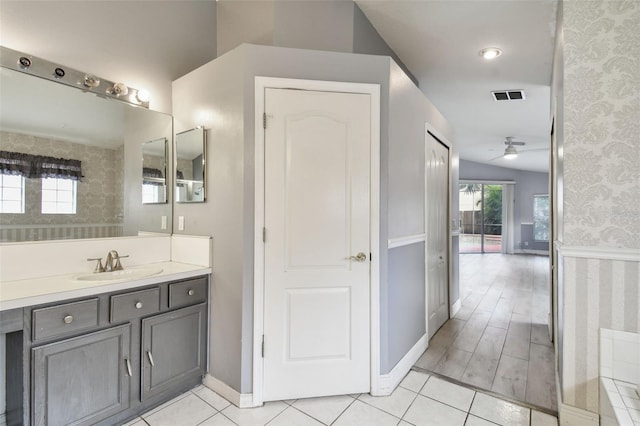 bathroom featuring ceiling fan, vanity, and hardwood / wood-style floors