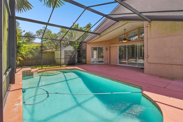 view of pool with a patio and a lanai