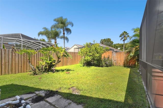 view of yard featuring a lanai