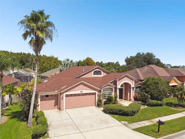 view of front of property with a garage and a front yard