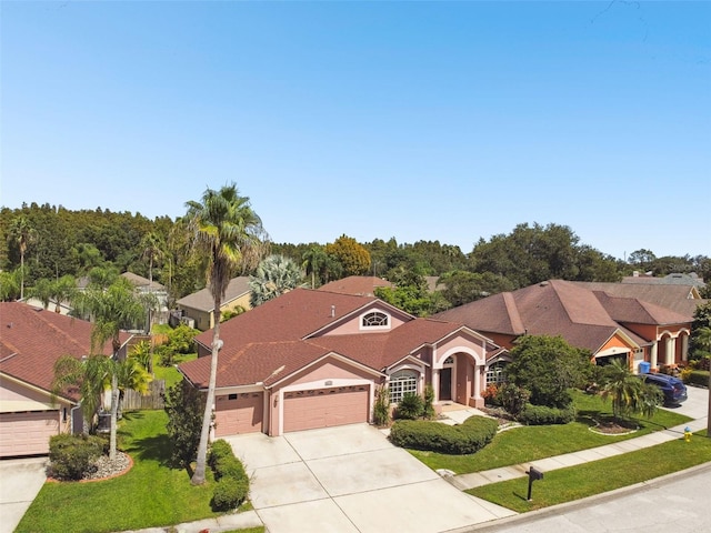 view of front of property with a garage and a front yard