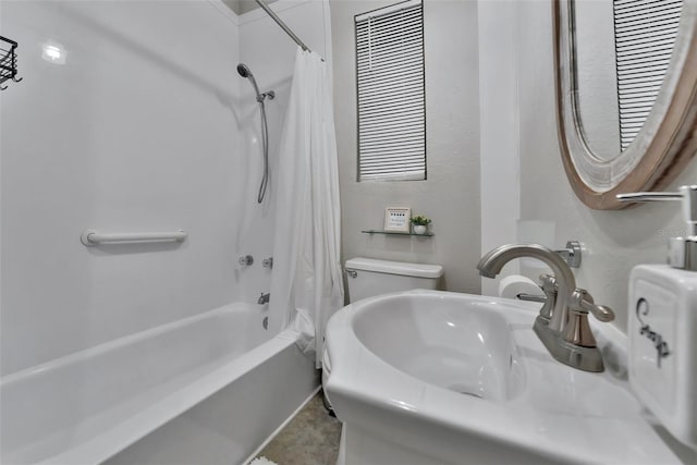 full bathroom featuring shower / tub combo with curtain, sink, and toilet