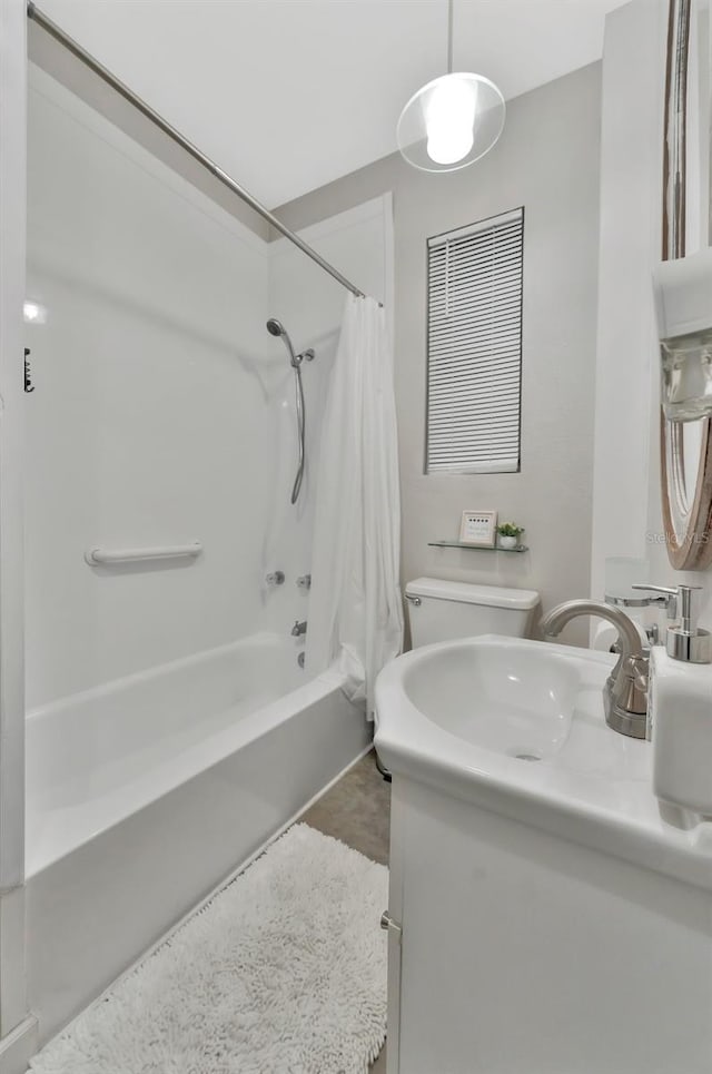 full bathroom with vanity, shower / tub combo, and toilet