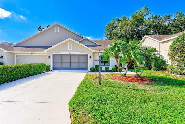 single story home with a front yard and a garage