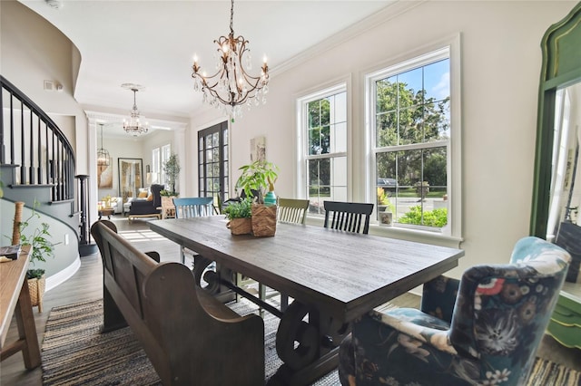 dining room featuring wood-type flooring and ornamental molding