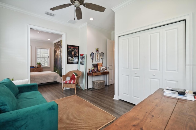 living area with dark hardwood / wood-style floors, crown molding, and ceiling fan