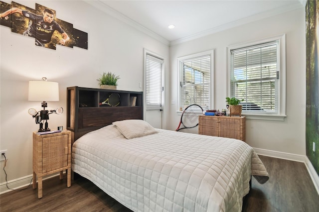 bedroom with ornamental molding and dark hardwood / wood-style floors