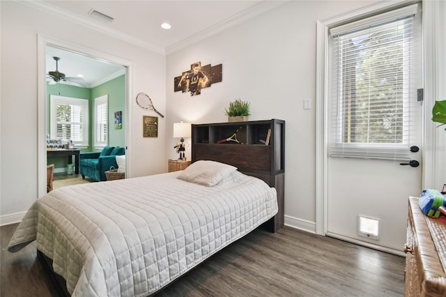 bedroom with dark hardwood / wood-style flooring and crown molding