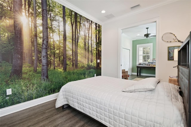 bedroom featuring wood-type flooring, ceiling fan, and crown molding