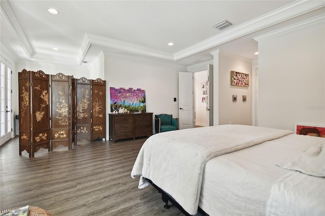 bedroom featuring ornamental molding and dark hardwood / wood-style flooring