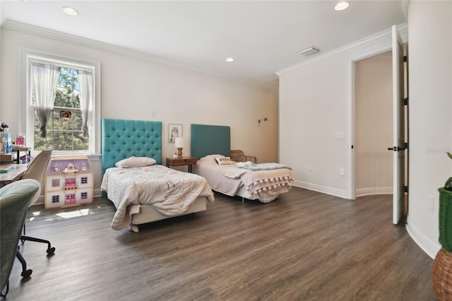 bedroom with dark hardwood / wood-style floors and crown molding