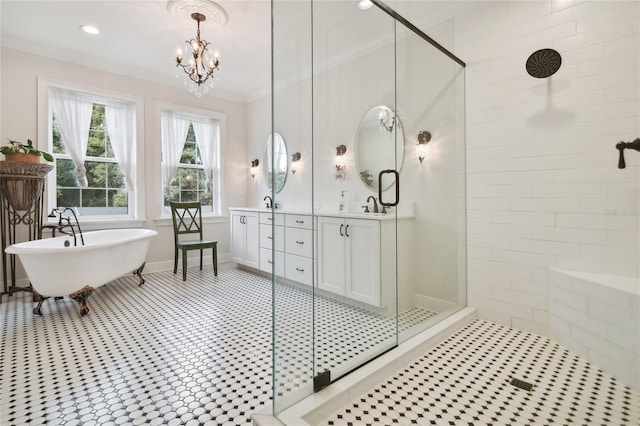 bathroom with a chandelier, vanity, crown molding, and separate shower and tub