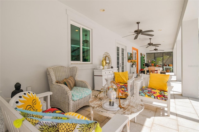 sunroom / solarium with ceiling fan