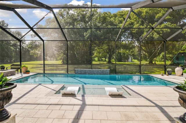 view of pool featuring a lanai and a patio area