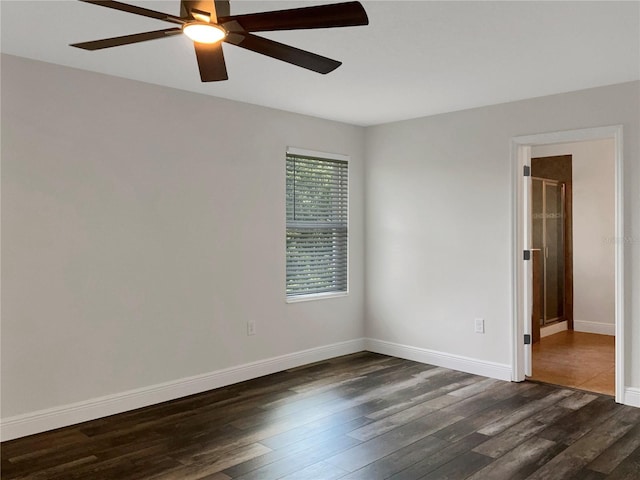 unfurnished room featuring ceiling fan and dark hardwood / wood-style floors