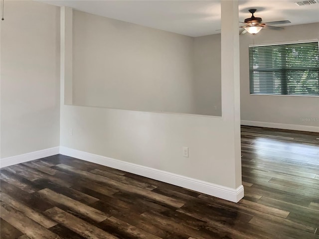 spare room with ceiling fan and dark hardwood / wood-style floors