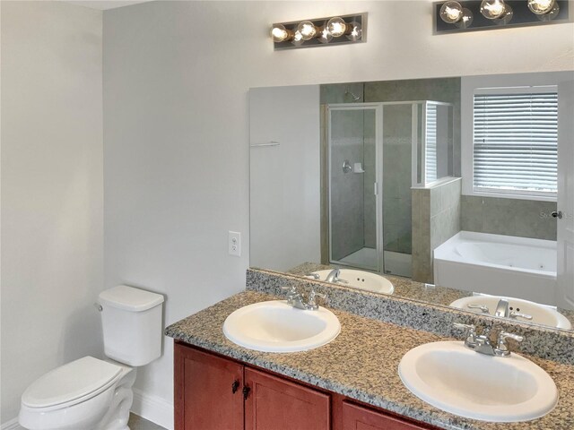 full bathroom with independent shower and bath, vanity, and toilet