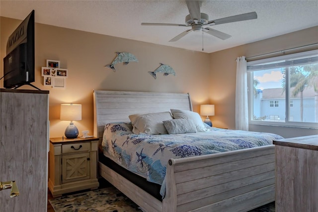 bedroom featuring a textured ceiling and ceiling fan