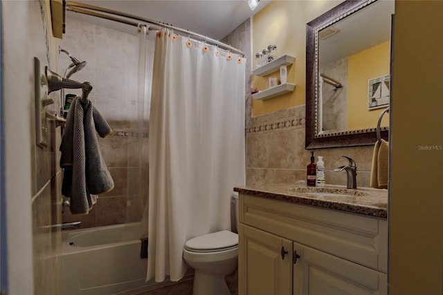 full bathroom with vanity, shower / bath combination with curtain, toilet, and tile walls