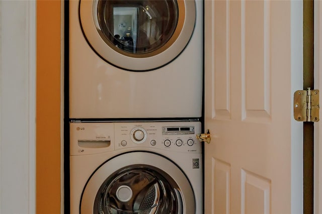 laundry room with stacked washer and dryer