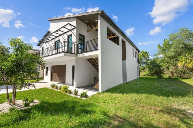 exterior space with a yard and a balcony