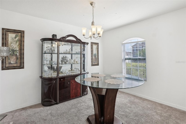 office space with a chandelier and light colored carpet