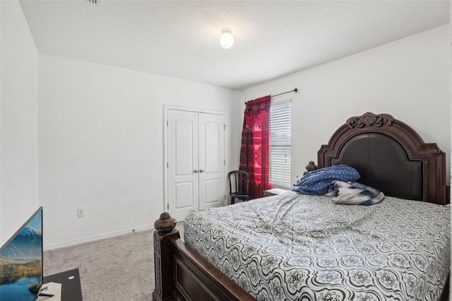 bedroom with a closet and carpet floors